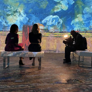 Immersive Van Gogh exhibition exterior with banner